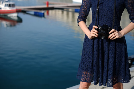 Woman holding vintage photo camera