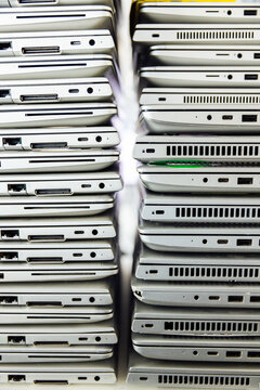 Broken old laptops stacked