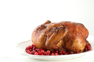 Delicious baked turkey and cranberries on white table, space for text