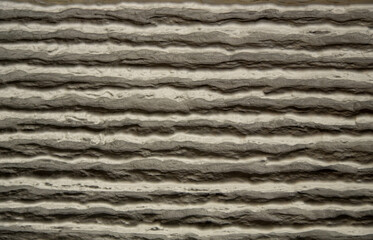 Textured plaster wall with horizontal cement lines