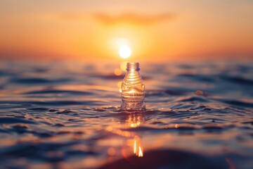 Plastic bottle floating in ocean sunset