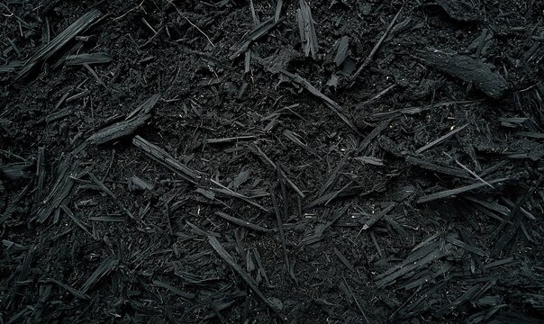 Dark wood chips mulch garden ground cover texture background gardening landscaping.