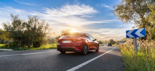 rental car in spain mountain landscape road at sunset