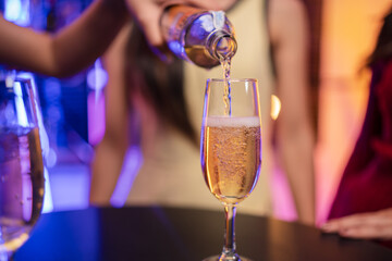 Party Celebrate whiskey at a friendly party in a restaurant. Night.