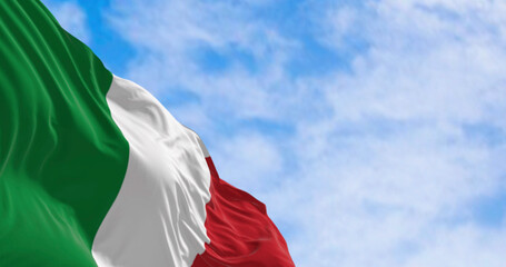 Close-up of the national flag of Italy waving in the wind on a clear day
