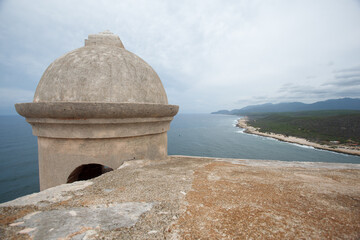 Castillo del Morro or San Pedro de la Roca fortress XVII century fortress, a turret and the entrance of Santiago de Cuba bay.