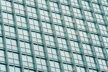 Fototapeta premium Architecture and real estate, residential apartment building with large panoramic windows, modern complex, angle view.