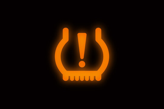 Tire pressure monitor system blinking rhythmically on a sleek black background. Ideal for showcasing advanced automotive safety technology and vehicle monitoring systems.