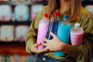 Unrecognizable Woman Holding Bottles of Detergent and Fabric Softener. Client  bulk buying...