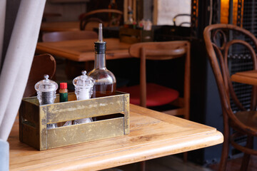 Charming Restaurant Table Setting Featuring Various Condiments and More