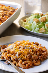 Ohio Tradition Johnny Marzetti Casserole, aka American Goulash, plated with a salad