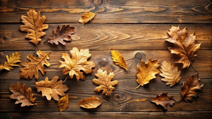 Fototapeta premium Autumnal foliage arranged on rustic wooden planks, showcasing the rich textures and warm colors of the season's transition.
