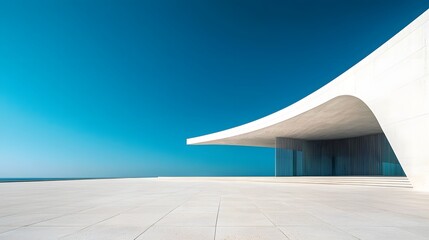 Sleek Modern Architectural Facade with Empty Concrete Floor and Clear Blue Sky