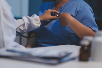 Asian female medical doctor use stethoscope to listen examine check senior elderly patient’s heart