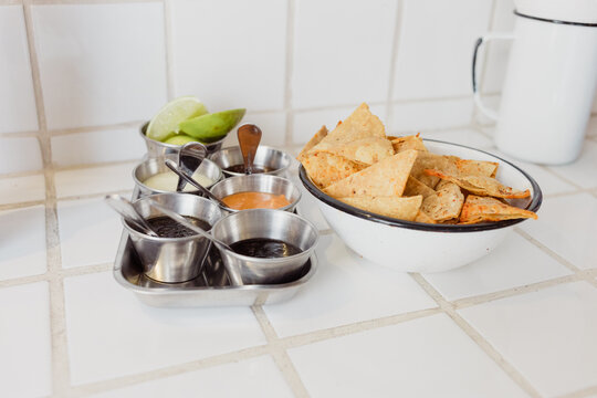 Mexican tortilla chips with spicy sauces for dipping