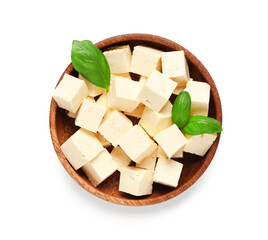 Bowl with pieces of tasty tofu cheese isolated on white background