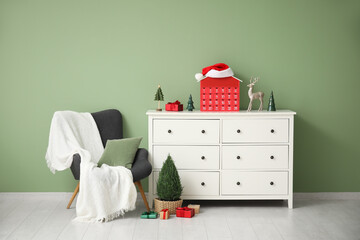 Interior of living room with armchair, commode and Christmas Advent calendar