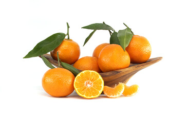 Fresh Ripe Tangerines with Leaves in a Wooden Bowl on White