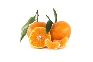 Freshly Picked Oranges with Leaves and Sliced Segments on White Background