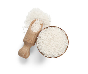 Wooden bowl and scoop with raw rice isolated on white background, top view