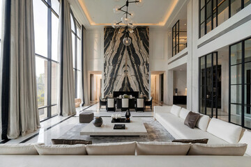 Luxury modern living room house apartment hotel with tall windows and modern furniture 