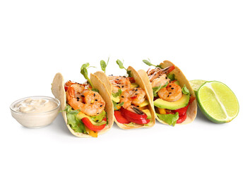 Tasty fresh tacos and lime isolated on white background
