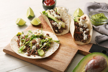 Tray with delicious fresh tacos on white wooden background