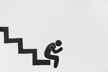 Sad paper human figure with steps on white background. Loser concept