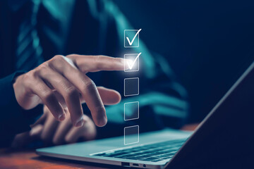 tick mark evaluation in the options check form online on a laptop. checklist concept, task audit in...