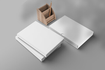 Blank hardcover book mockup with pencil an pencil box left angle view