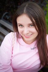 Fototapeta premium Portrait of young pretty woman with long brown hair