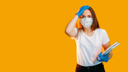 Quarantine homeschooling. Pandemic restriction. Disappointed scared female student in mask gloves...