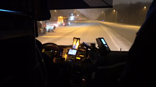 Stockholm, Sweden The view from a bus driving on a snowy E4 highway in the winter. 