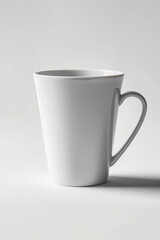 Obraz premium Minimalist composition of a clean white ceramic coffee mug on a flat white background for design mockup use