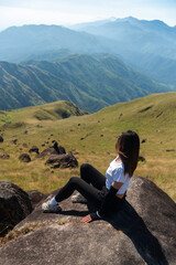 Naklejka premium Hiker asian backpack walking trail activity camping outdoors and People exploring forest green natural capturing beauty nature outdoor.