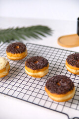 close up chocolate and cheese donuts on food tray, sweet breakfast menu.