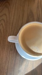 cup of coffee on wooden table