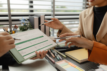 Several employees work together in a company, A group of business people sit together and discuss and exchange ideas about the content of the work, colleagues planning together in the office