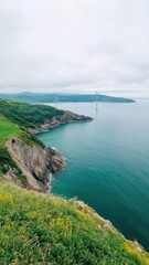 Obraz premium A serene scene of a wind turbine farm near a tranquil landscape, showcasing sustainable energy in harmony with nature.