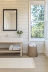 Bright modern bathroom featuring a large window and natural light with minimalistic design