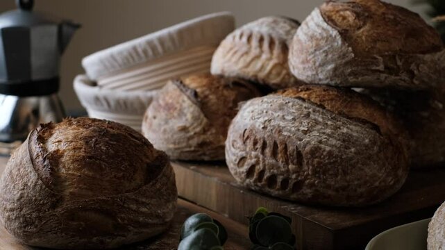 Artisan Batard Sourdough healthy Bread with leaf scoring. Open crumb high hydration Sourdough bread set on table.