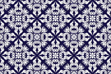Seamless traditional Thai art bold white colored floral arabesque pattern in damask style motifs suitable for wallpaper, curtain, clothing, fabric and textiles design isolated over blue background.