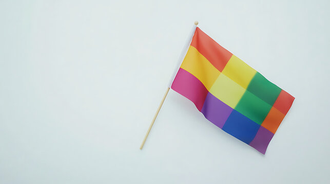 The rainbow flag or LGBTQ flag is on a white background. Top view. Flat lay. Space for text. Gender diversity concept