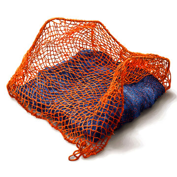 Intricate Woven Netting: A Study in Texture and Form. Detailed close-up of a vibrant orange net draped over blue fabric, showcasing the intricate mesh pattern and interplay of colors.