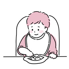 スプーンを持つ笑顔の赤ちゃん