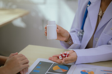 Nutritionist giving consultation to patient with healthy fruit and vegetable, Right nutrition and...