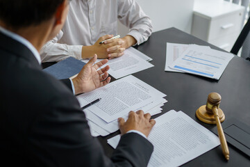 Lawyer Legal counsel presents to the client a signed contract with gavel and legal law. justice and...