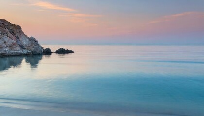 Obraz premium Serene Ocean Sunset with Soft Pastel Colors