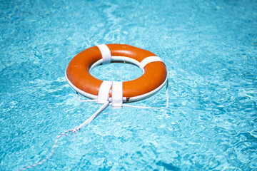 No swimming. Drowning concept. Rescue swimming ring in water. Safety water equipment. Lifebelt on...