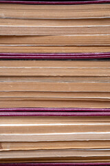 Front close-up view of stacked books and their pages